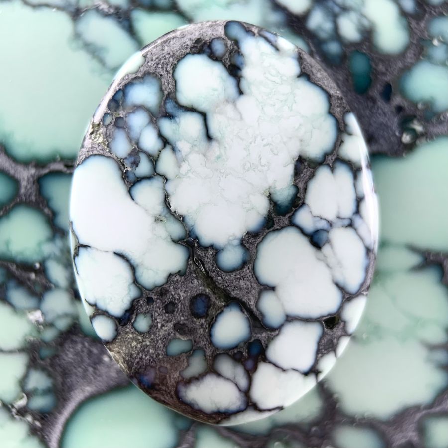 Polished variscite cabochon from the Calypso mine, Nevada